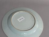 a plate with a tag on it sitting on a table