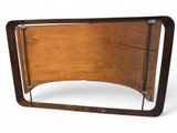 a picture of a wooden bed frame with a mirror on it