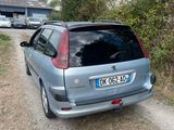 a small car parked on the side of a dirt road