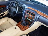 a car dashboard with a steering wheel and a dash board