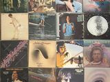 an image of a collection of vinyl records on a wall