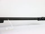 a close up of a gun on a white surface with a white background