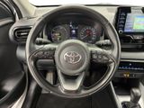 the interior of a car with a steering wheel and dashboard controls