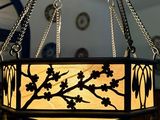 a chandelier hanging from a ceiling in a living room