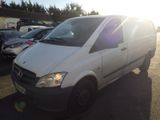 a white van that is parked in a parking lot