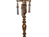 an antique brass table lamp with a bird on top of it