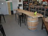 an image of a wine shop with a wooden bar
