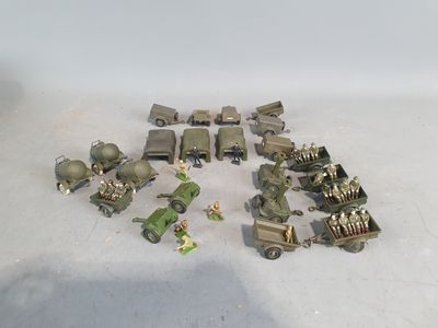 a lot of toy army vehicles on a table