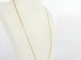a white mannequin torso with a gold chain on it