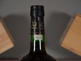 a bottle of wine that is sitting on a table