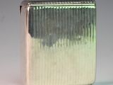 a silver lighter that is sitting on a table