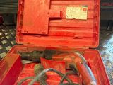 a red tool box with tools in it on a table