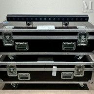 three cases are stacked on top of each other in a room