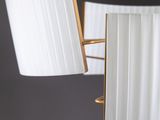 a close up of a lamp on a table with a mirror in the background