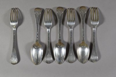 six silver spoons and a fork are lined up on a white surface