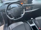 the interior of a car with a steering wheel and dashboard controls