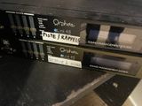 two cassette players sitting on top of a black table