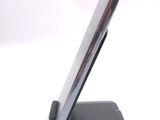 a cell phone that is sitting on top of a stand