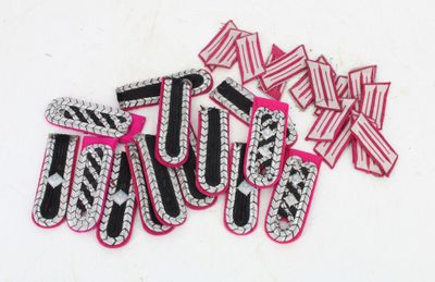 pink and black letters with zebra stripes and bows on a white surface