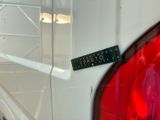 a sticker on the back of a white car