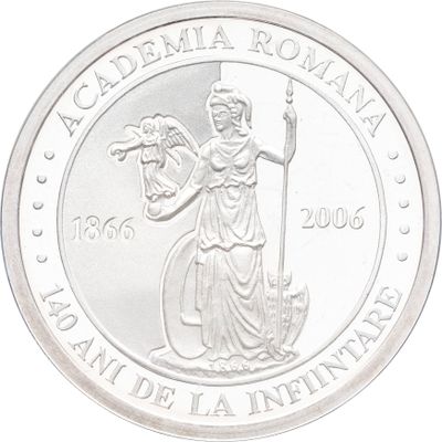 une image représentant une pièce d'argent sur laquelle figure une femme tenant un bâton