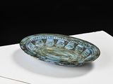 a blue bowl sitting on top of a white table