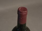 a bottle of wine that is sitting on a table