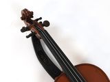 a violin that is sitting on a white surface
