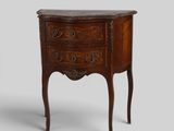 an old wooden chest of drawers with a marble top