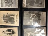 a lot of old photos on display in a glass case