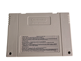 an old nintendo game on a white surface