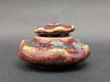 a small ceramic object that is sitting on a table