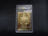a close up of a piece of gold with a basketball player on it