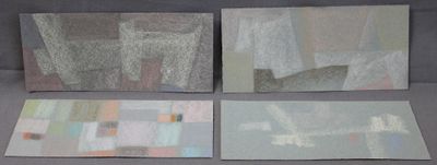 four pieces of paper with different designs on them on a gray surface