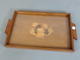 a picture of a wooden tray with a painting on it