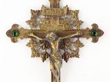 an image of a cross with a crucifix and a green bead on it