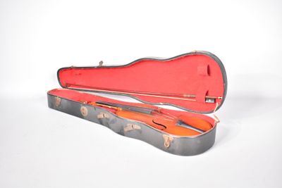 a guitar case that is open on a white surface