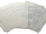 a pile of old papers that are on a table