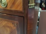 a wooden cabinet with a brass knob on it