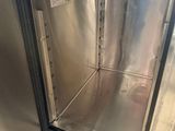 a stainless steel oven inside of a kitchen