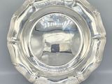 a silver plate with a picture of a sheep on it