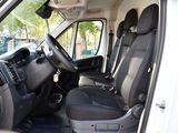 a white van with black seats in a parking lot