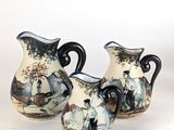 three vases that are sitting on a white surface