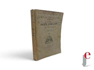 an old book sitting on top of a table next to a white background
