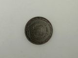 an image of a silver coin on a white surface