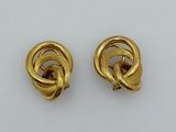 a pair of gold tone earrings with a knot design