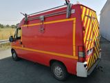 an image of a red and yellow fire truck parked on the side of the road