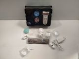 a box with a hair dryer and other items on a table