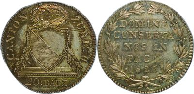 a gold coin with a shield on the front and a shield on the back