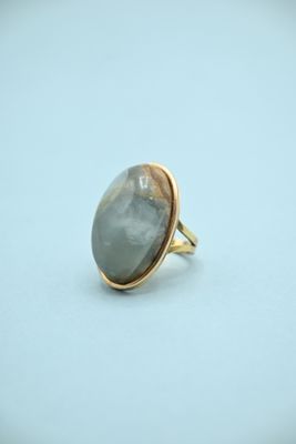 a close up of a ring with a stone in it